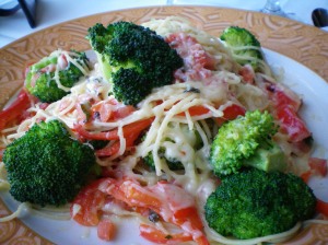 Pasta with lightly cooked tomatoes, broccoli, red bell pepp, basil, and some cheese