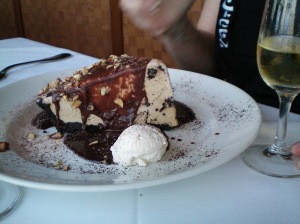 Mud pie with chocolate sauce, nuts, and whipped cream